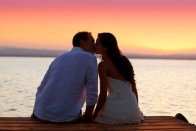 Couple in love, kissing at sunset, to represent reconnecting with lost love with the aid of psychic Mkuru